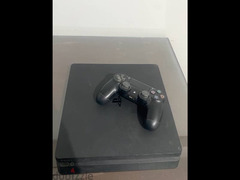 ps4 slim with a controller and games