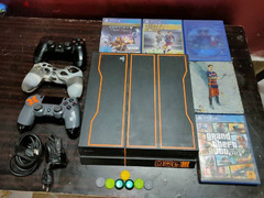 PlayStation 4 Fat 1TB with two controllers and 6 games 4 cd and 2 acc