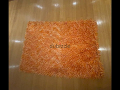 ‏سجادة برتقالي في أبيض 135  في 200 سانتي/ orange and white carpet