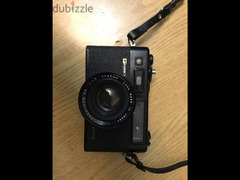 Yashica electro 35 GTN camera black colored and Raynox flash