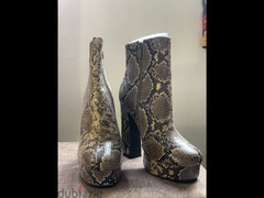 Ankle boots in serpent print