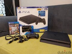 PS4 Slim 500GB.   +   GTA.  + 2 controller.  + وصلات - 2