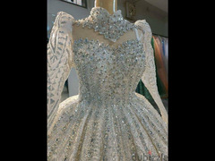 فستان زفاف ملكي خامات مستورده ومتوفر تشكيله مميزه باسعار مناسبه جدا
